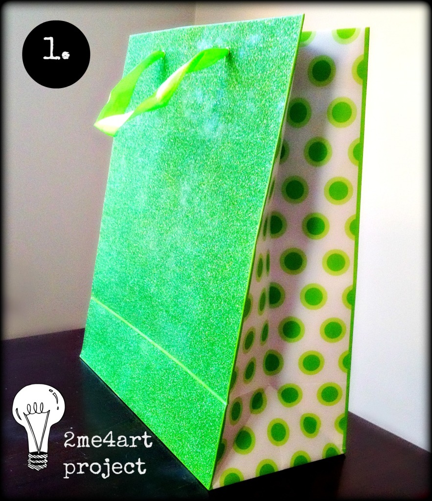 Pick out cool gift bag. (I bought this one for 1.99) new or given to you.  Green glitter outside, green polkadots on the inside…